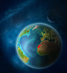 Western Sahara from space on planet Earth in space with Moon and Milky Way. Extremely fine detail of planet surface.