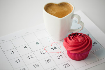 valentines day and holidays concept - close up of calendar sheet with 14th february date marked by...