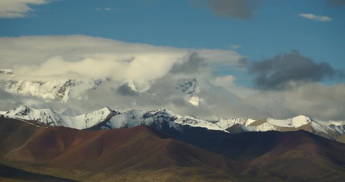 4k time lapse of huge clouds mass rolling over lake namtso & Tanggula snow mountain peak,tibet mansarovar,Tibet's second largest lake,is the third largest saltwater lake in China.