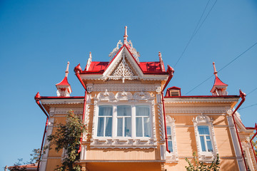 Wooden house with carving against the blue sky, Tomsk, Russia