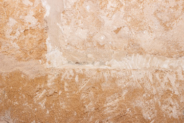 Rough weathered natural old stone wall background, various colored