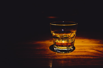 Glass of whiskey on bar table