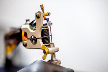 tattoo equipment machine and colorful ink in a workshop