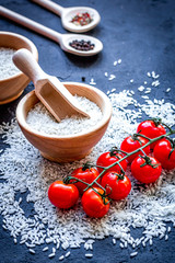 ingredients for paella on dark background