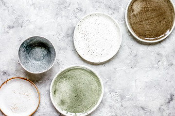 ceramic tableware top view on stone background mock up