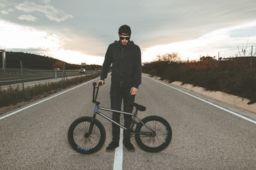 BMX rider. Young man with a bmx bike. Extreme sports
