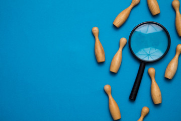 Recruitment concept. Magnifying glass with wooden people. Talent, Job, Opportunity concept