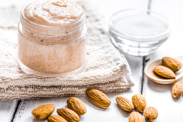 spa concept with almond nuts on wooden background