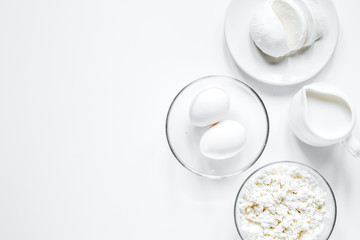 monochrome concept with dairy products on white table top view m