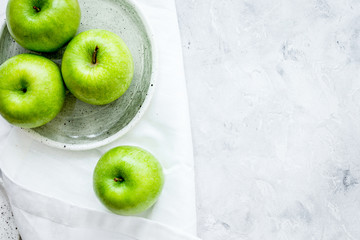 Healthy green food with apples on plates stone background top vi