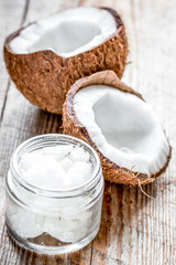 organic cosmetics with coconut on wooden background