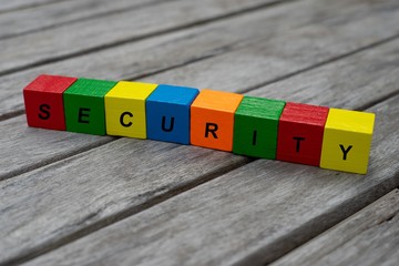 colored wooden cubes with letters. the word security is displayed, abstract illustration