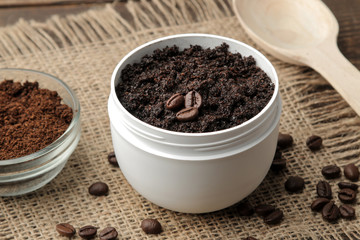homemade coffee scrub in a white jar for the face and body and various ingredients for making scrub. spa. cosmetics. care cosmetics