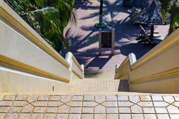 paradise road with stairs leading to the beach