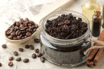 homemade coffee scrub in a jar for the face and body, and various ingredients for making scrub on a light background. spa. cosmetics. care cosmetics.