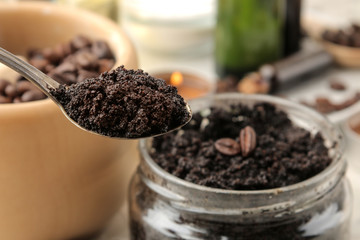homemade coffee scrub for face and body in a spoon close-up on a light background. care cosmetics.