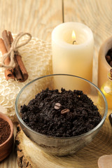 homemade coffee scrub in the face and body bowl and various ingredients for making scrub on a wooden table. spa. cosmetics. care cosmetics.