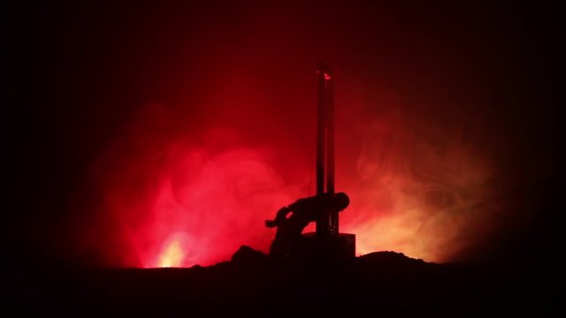 Horror view of Guillotine. Human at guillotine on a dark foggy background. Execution concept