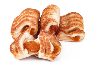 puff pastry with apple and apricot jam isolated on white background