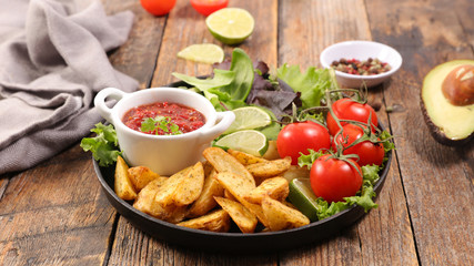 french fries with sauce and salad