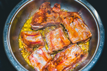 Pork ribs in a pan in boiling oil