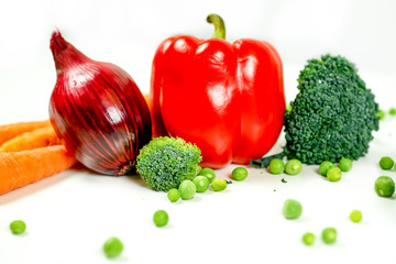 a fresh group of vegetables on white background