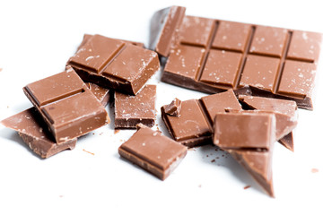 chocolate bar, shavings and cookies on a table