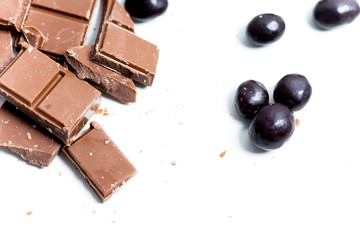 chocolate bar, shavings and cookies on a table