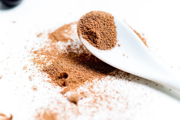chocolate bar, shavings and cookies on a table
