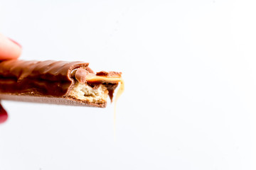 chocolate bar, shavings and cookies on a table