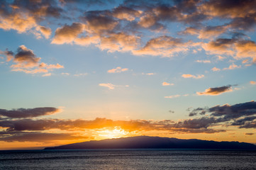 Fototapeta na wymiar Canary islands romantic sunset in the ocean. View from Tenerife to Gomera.