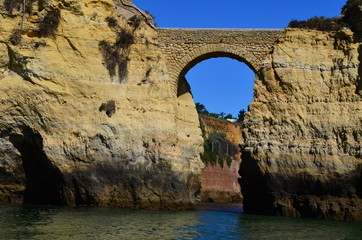 old stone bridge over the sea