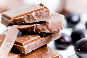 chocolate bar, shavings and cookies on a table