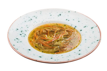 Minestrone with vegetable noodles. Vegetarian dish. On white background.