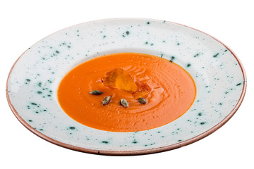 Pumpkin cream soup. Vegetarian dish. On white background.