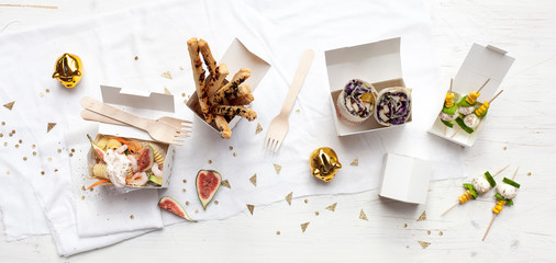 Fototapeta na wymiar Happy New Year - white table with food snacks