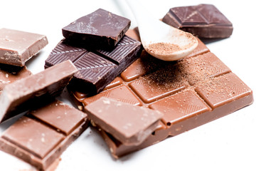 chocolate bar, shavings and cookies on a table