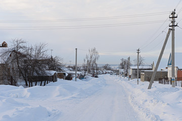 Fototapeta na wymiar February 4, 2017: Photo of the snow-covered street of the village of Sugaykasy. Chuvashia Russia.