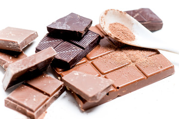 chocolate bar, shavings and cookies on a table