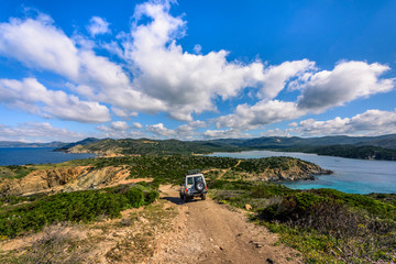 Offroad car driving on a challenging way at Cabo Carbonara, Sardinia, Italy © CA Irene Lorenz