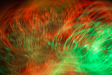 Defocused colored luminous spots and curved lines. For background
