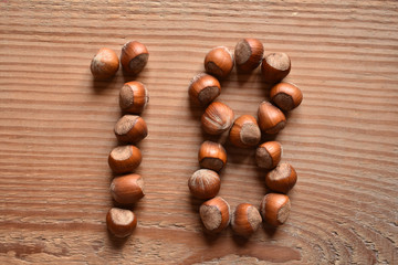 the number 18 shaped with hazelnuts