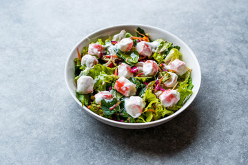 Crab Sticks Surimi Salad with Sauce. in Glass Bowl.