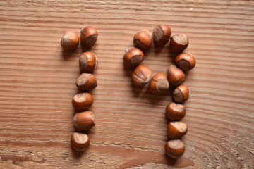 the number 19 shaped with hazelnuts