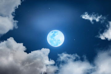 Naklejka na ściany i meble Mystical Night sky background with full moon, clouds and stars. Moonlight night with copy space for winter background