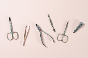 professional manicure tools on pink background. Manicure set. Top view