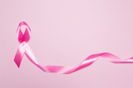 Pink ribbon, breast cancer symbol. Copy space. Top view.