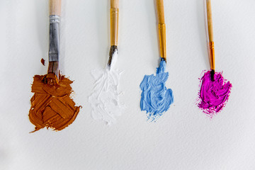 Artistic palette with paint brushes and oil paint