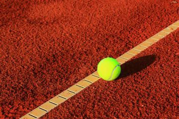 Tennis balls on a tennis clay court © Željko Radojko
