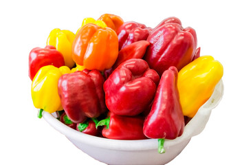 Red and yellow sweet bell peppers on table, close up